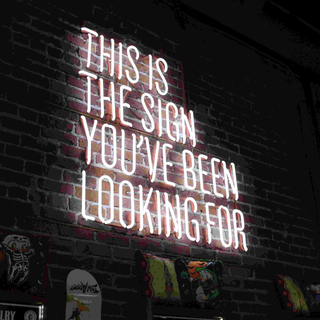 a neon sign that say this is the sign you've been looking for